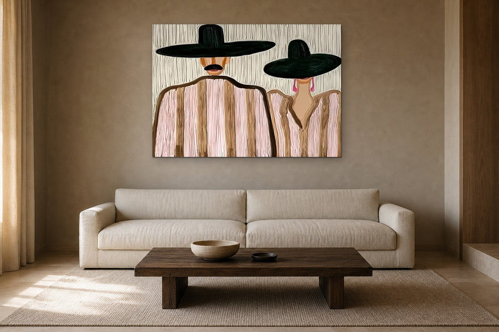 The Couple in Pink Stripes shown at 130 × 90 cm above a 230 cm linen sofa