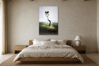 The Lone Tree shown at 90 × 130 cm above a 180 cm oak bed