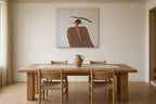 The Balancing Woman shown at 70 × 70 cm above a 200 cm oak dining table