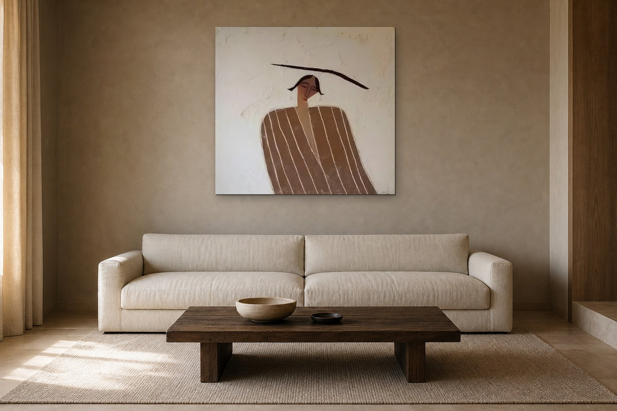 The Balancing Woman shown at 100 × 100 cm above a 230 cm linen sofa
