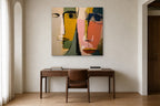 Two Faces shown at 110 × 110 cm above a 160 cm walnut desk